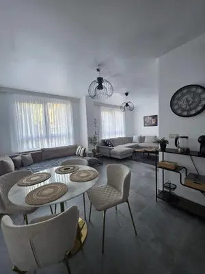 a living room with couches and a table and chairs at Nord Center 1D in Brussels