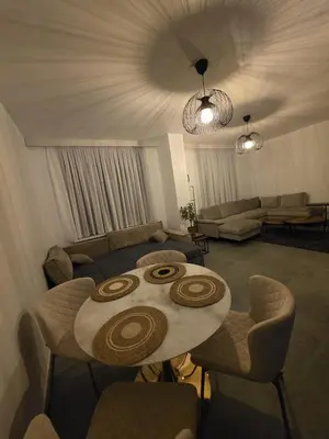 a living room with a table and a couch at Nord Center 1D in Brussels