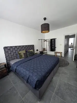 a bedroom with a large bed in a room at Nord Center 1D in Brussels