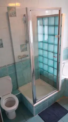 a bathroom with a shower and a toilet at Charming studio apartment with terrace near Mérode in Brussels