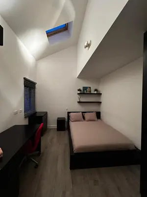 a bedroom with a bed and a desk and a bed sidx sidx sidx at 3 bedroom Loft Antwerp in Antwerp