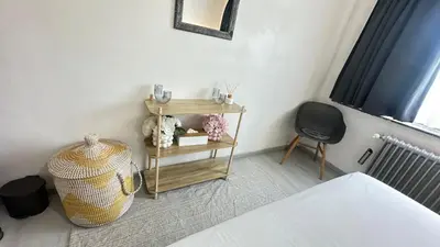 a bedroom with a table with a bed and a chair at Villa-gey Escape in Bekkevoort