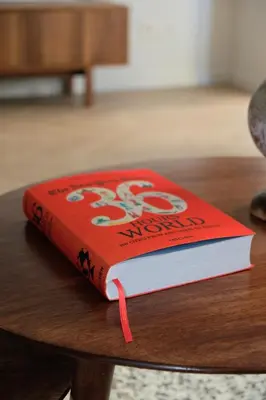 a red book sitting on top of a table at Brussels center spacious and central apartment in Brussels