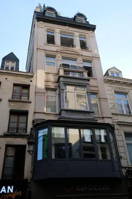 a tall building with a lot of windows on it at Brussels center spacious and central apartment in Brussels