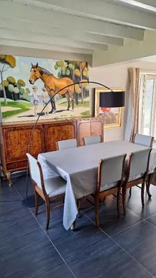 a dining room with a table and a piano at Peaceful Countryside Escape for Leisure or Work, Near Brussels in Dilbeek
