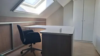 an office with a desk and a chair and a skylight at Peaceful Countryside Escape for Leisure or Work, Near Brussels in Dilbeek