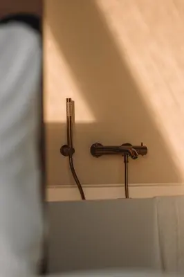 a wall mounted towel rack in a hotel room at SKIPR Hotel - adults only in Antwerp