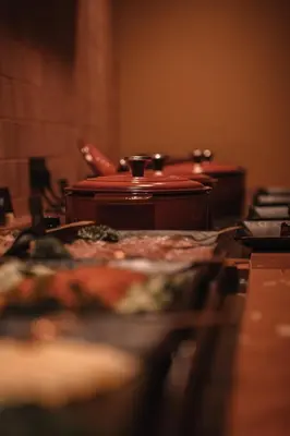 a table with plates of food on top of it at SKIPR Hotel - adults only in Antwerp