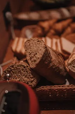 a basket full of breads in a basket at SKIPR Hotel - adults only in Antwerp