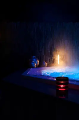 a massage bed with a light on top of it at B&B by Delizia met mogelijkheid tot bijhuren van privé wellness in Rumst
