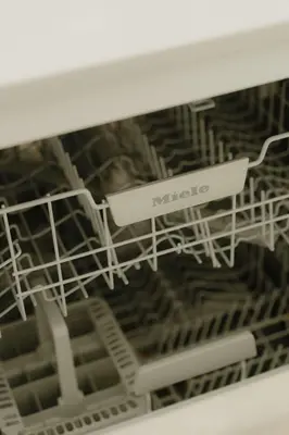 a dish rack in a dishwasher with a mico sign at Boutique Guesthouse - Private Top floor - 3 rooms - host on site available in Ghent