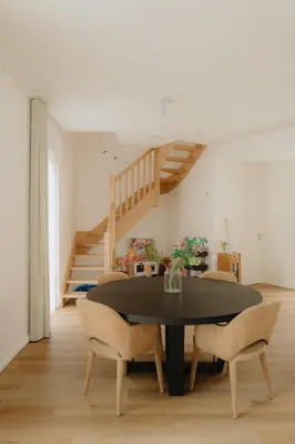 a dining room with a black table and chairs at Boutique Guesthouse - Private Top floor - 3 rooms - host on site available in Ghent