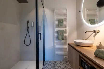 a bathroom with a sink and a mirror at Logies De Hoeven in Kasterlee