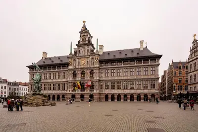 a large building with a clock tower on top of it at SHWAY - The Second Mate's Glance in Antwerp