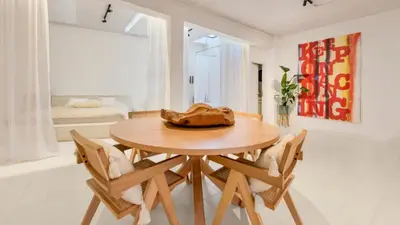 a dining room with a wooden table and chairs at Spacious loft near City Centre, Luce CasaMia in Antwerp