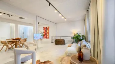 a living room with a couch and a table at Spacious loft near City Centre, Luce CasaMia in Antwerp