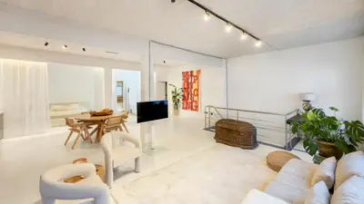 a living room with a couch and a table at Spacious loft near City Centre, Luce CasaMia in Antwerp