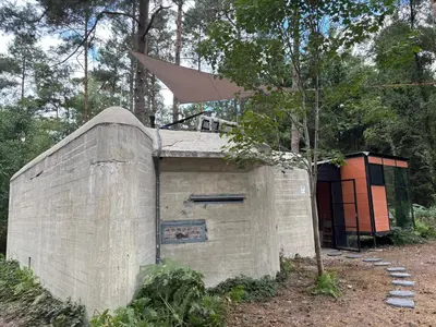 a building in the middle of a forest at TerraVenturia - Natura Pirsch in Rixensart