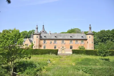 an old castle in a field with trees at TerraVenturia - Natura Pirsch in Rixensart