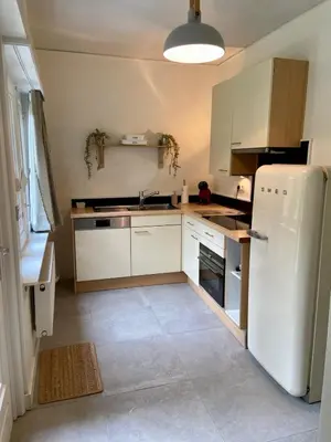 a kitchen with white appliances and a white refrigerator at Romantic BNB, Castle-Nature Walks, Sauna, Garden in Schilde