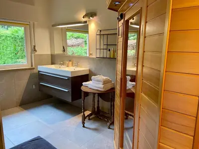 a bathroom with a sink and a mirror at Romantic BNB, Castle-Nature Walks, Sauna, Garden in Schilde