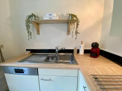 a kitchen with a sink and a counter top at Romantic BNB, Castle-Nature Walks, Sauna, Garden in Schilde