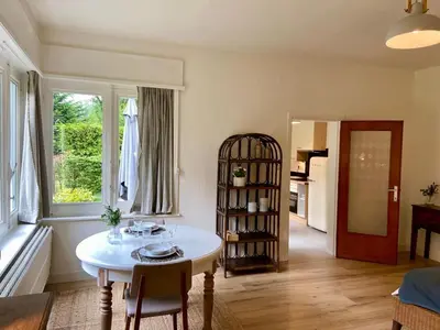 a living room with a table and a window at Romantic BNB, Castle-Nature Walks, Sauna, Garden in Schilde