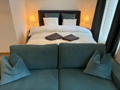 a bed with two pillows on top of it at Center monet in Ghent