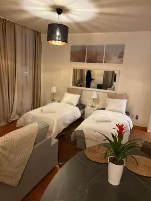 a living room with two beds and a couch at Center monet in Ghent