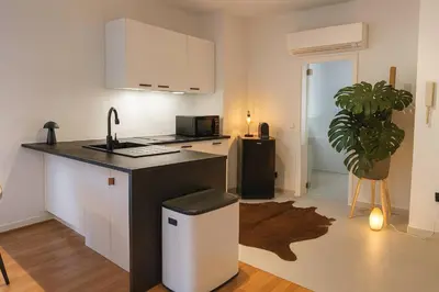 a kitchen with a sink and a counter top at Modern Comfort - Bus & Tram at Door in Antwerp