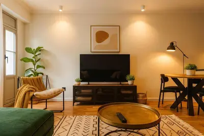 a living room with a television and a table at Modern Comfort - Bus & Tram at Door in Antwerp