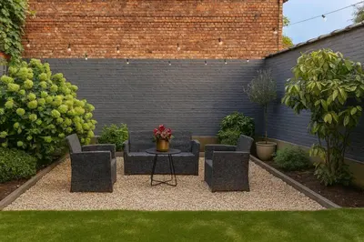a patio with a table and chairs in a garden at Modern Comfort - Bus & Tram at Door in Antwerp