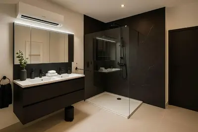 a bathroom with a sink and a shower at Modern Comfort - Bus & Tram at Door in Antwerp
