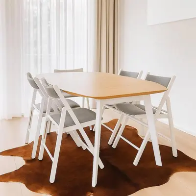 a white dining table and chairs in a room at Cozy Family Apartment - Bus & Tram Right in Front in Antwerp