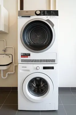 a washing machine and a dryer in a kitchen at Cozy Family Apartment - Bus & Tram Right in Front in Antwerp