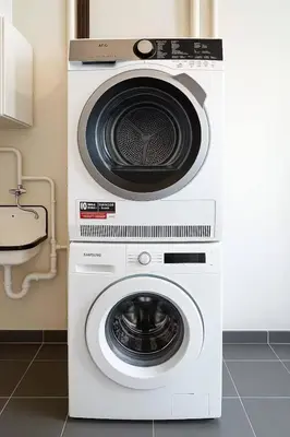a white washer and dryer in a kitchen at Cozy & Relaxing Apartment - Bus & Tram at Door in Antwerp