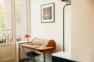 a desk in a room with a window at La Villa Maurice in Brussels