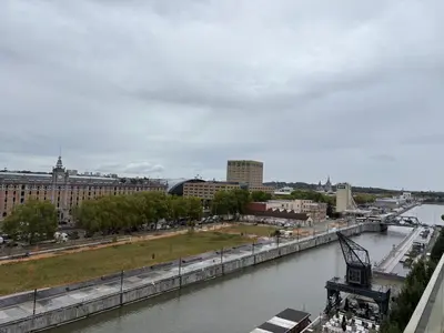 a view of a river in a city at Top floor luxury with spectacular water views in Brussels
