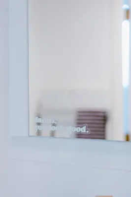 a shelf in a kitchen with a stack of dishes at Slow Moments in Brussels in Brussels