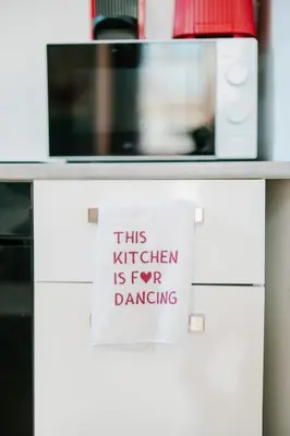 a sign that says this kitchen is for dancing at Slow Moments in Brussels in Brussels