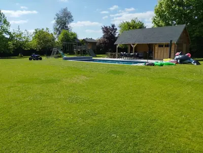 a yard with a swimming pool and a house at Il Giardino Segreto in Waterloo