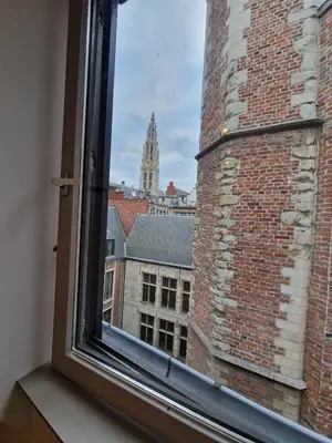 a view of a city from a window at Appartement historisch centrum Antwerpen in Antwerp