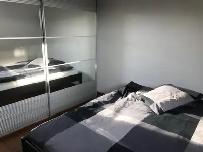 a bedroom with a bed and a glass wall at Fokus time out 2 in Dessel