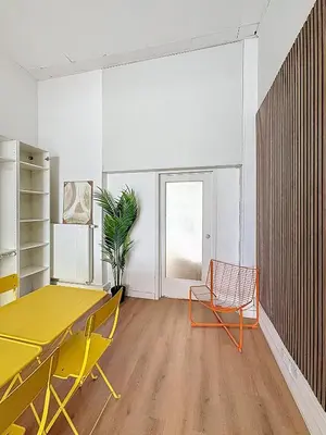 a dining room with a yellow table and chairs at Central Spot - Louise in Brussels