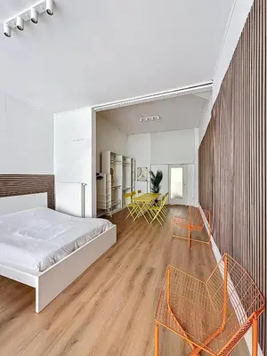a bedroom with a bed and two chairs at Central Spot - Louise in Brussels