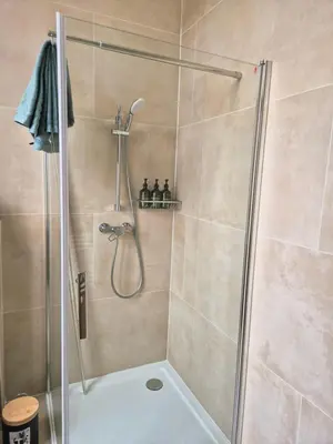 a shower with a glass door in a bathroom at Studios - European Quarter in Brussels