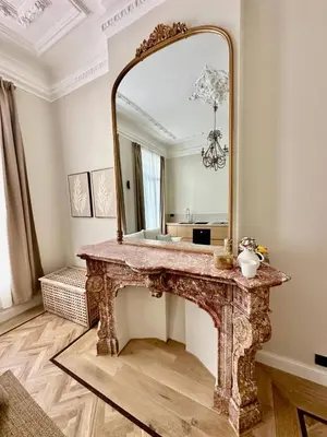 a bathroom with a vanity with a large mirror on it at charm and comfort in Brussels