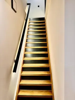 a staircase in a building with wooden steps at charm and comfort in Brussels