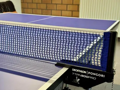 a tennis racket sitting on top of a table at 3BR Villa with Big Garden, Ping-Pong, Cinema, Bath in Ghent