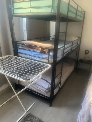 a bunk bed with four bunk beds in a room at Big beautiful appartement in center of Antwerpen in Antwerp